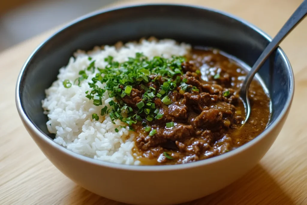 Rice with beef broth served in a bowl.