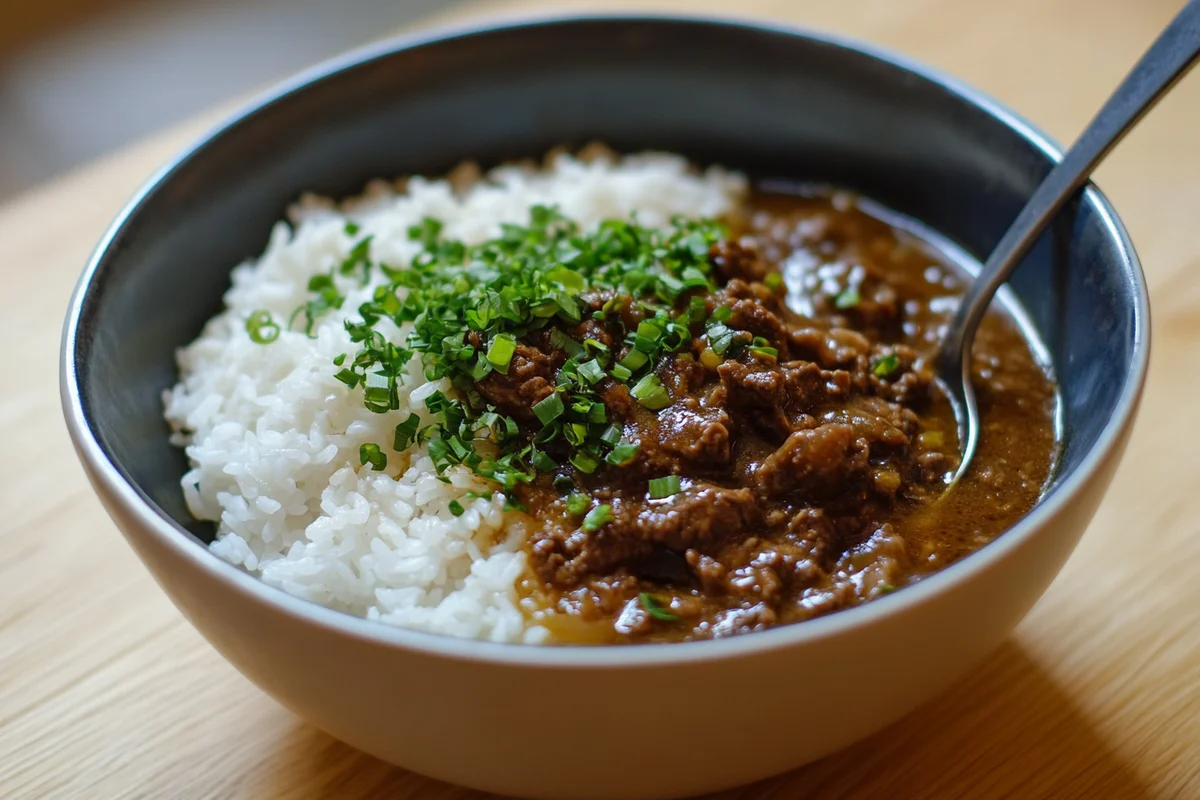 Rice with beef broth served in a bowl.