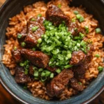 Beef dirty rice recipe in a serving dish.
